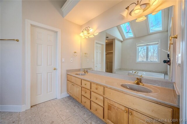 full bathroom with tile patterned floors, double vanity, a bath, and a sink