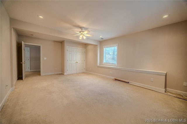 unfurnished bedroom with a ceiling fan, baseboards, recessed lighting, a closet, and light colored carpet