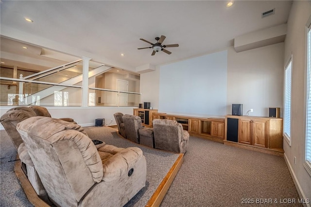 carpeted living room featuring beverage cooler, a ceiling fan, visible vents, ornate columns, and recessed lighting