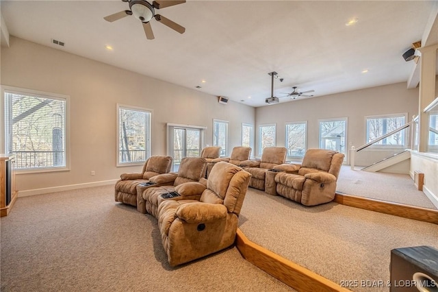 cinema with a wealth of natural light, carpet flooring, and ceiling fan