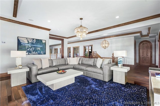 living room with a chandelier, recessed lighting, crown molding, and wood finished floors