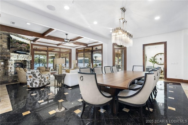 dining space featuring granite finish floor, recessed lighting, and baseboards