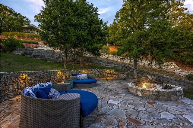 view of patio / terrace featuring an outdoor fire pit