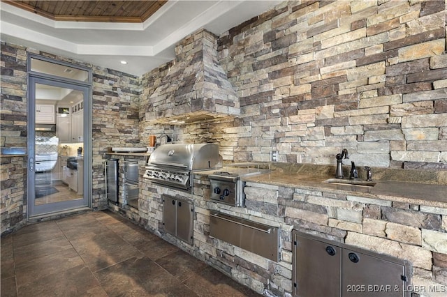 view of patio featuring area for grilling and a sink