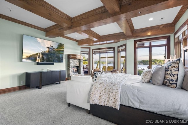 bedroom with baseboards, beamed ceiling, light colored carpet, a fireplace, and coffered ceiling