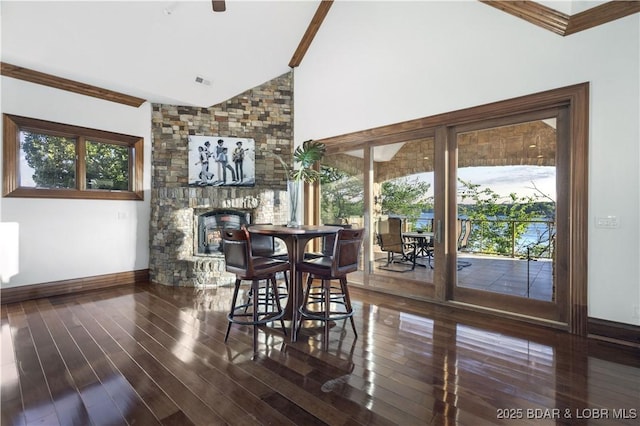 dining room featuring baseboards, a healthy amount of sunlight, and wood finished floors