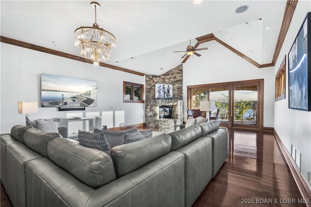 living room featuring dark wood-style flooring, a fireplace, baseboards, ceiling fan with notable chandelier, and vaulted ceiling