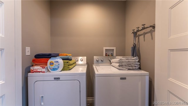 laundry area with laundry area and separate washer and dryer