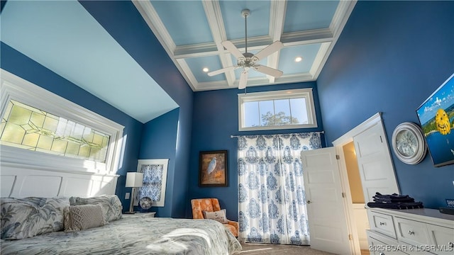 carpeted bedroom featuring beam ceiling, coffered ceiling, crown molding, and a towering ceiling