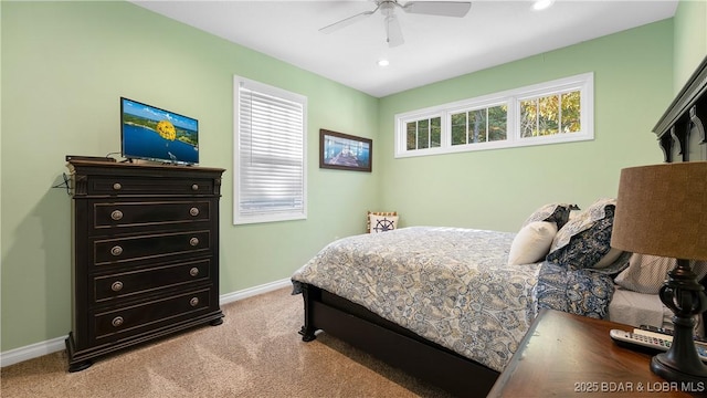 bedroom featuring recessed lighting, multiple windows, light colored carpet, and baseboards