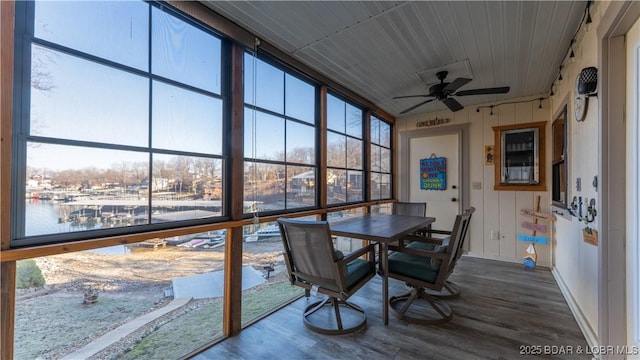 sunroom with a healthy amount of sunlight and a ceiling fan