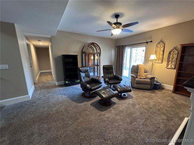 living area with carpet flooring, a ceiling fan, and baseboards