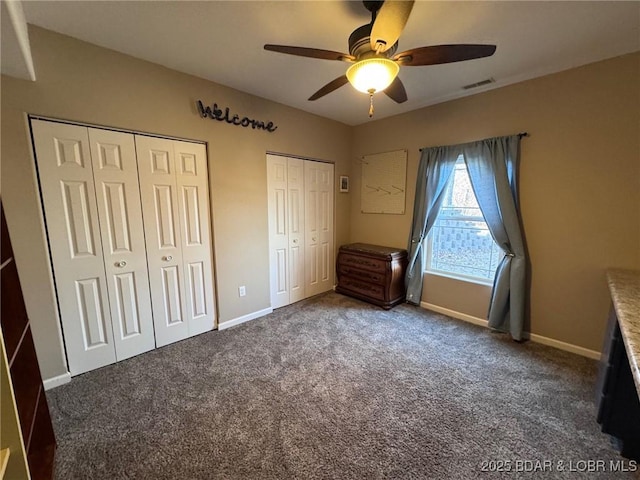 217 Highline Rd, Lake Ozark, MO 65049 - unfurnished bedroom featuring visible vents, carpet flooring, baseboards, and two closets