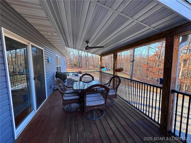 wooden terrace featuring a ceiling fan