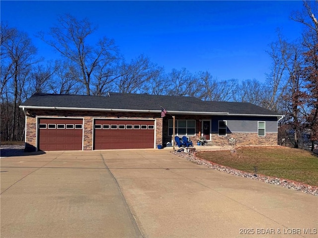 217 Highline Rd, Lake Ozark, MO 65049 - single story home with a garage, driveway, a front lawn, and stone siding
