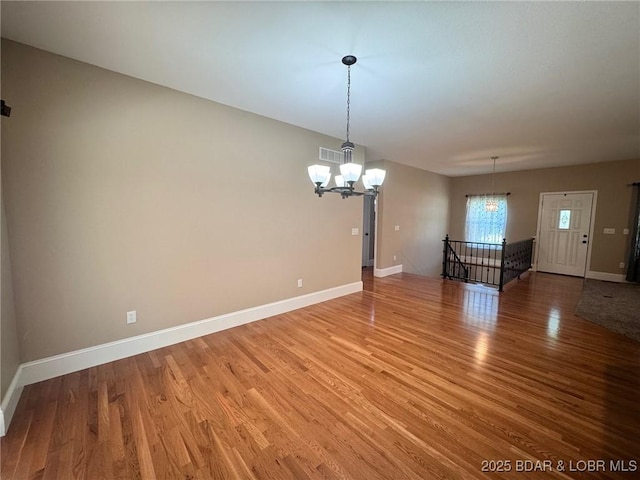 217 Highline Rd, Lake Ozark, MO 65049 - empty room featuring a chandelier and light wood finished floors