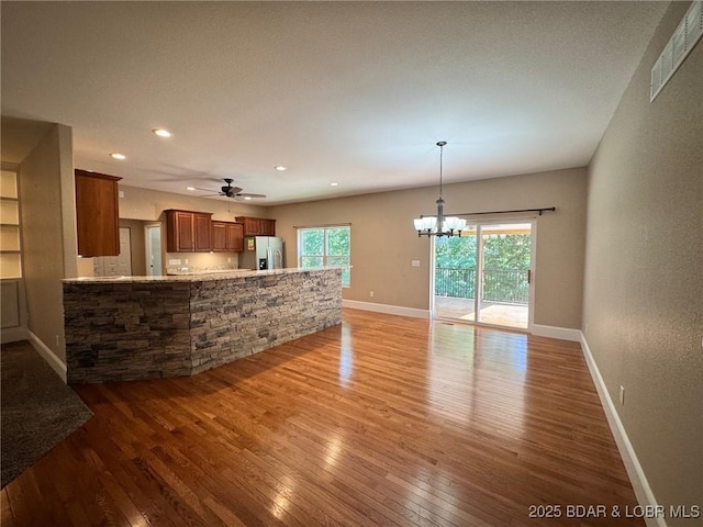 217 Highline Rd, Lake Ozark, MO 65049 - unfurnished living room featuring light wood finished floors, a chandelier, recessed lighting, and a ceiling fan