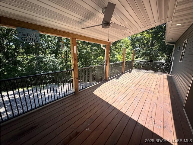 217 Highline Rd, Lake Ozark, MO 65049 - wooden deck with a ceiling fan and view of wooded area