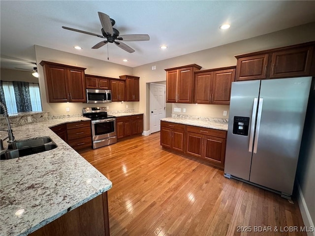 217 Highline Rd, Lake Ozark, MO 65049 - kitchen with stainless steel appliances, ceiling fan, light wood-style floors, and recessed lighting