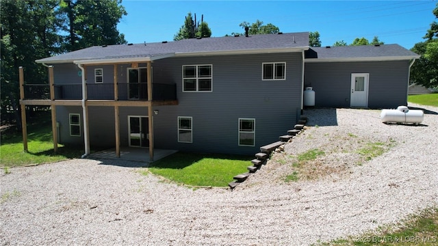 217 Highline Rd, Lake Ozark, MO 65049 - back of property with a patio and a lawn