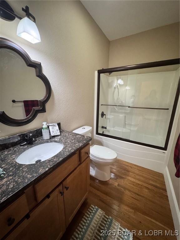 217 Highline Rd, Lake Ozark, MO 65049 - bathroom with wood finished floors, vanity, and shower / bath combination with glass door
