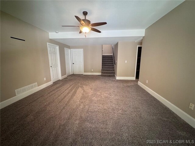 217 Highline Rd, Lake Ozark, MO 65049 - unfurnished living room featuring a ceiling fan, stairway, and carpet floors