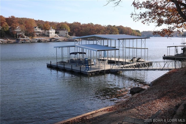 dock area featuring a water view and boat lift