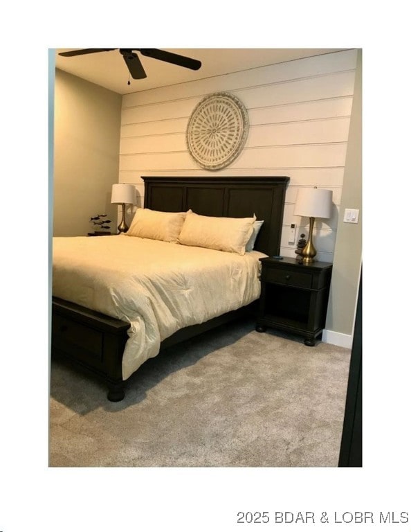 bedroom with ceiling fan and carpet floors