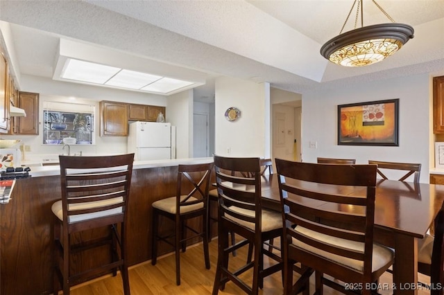 dining room featuring light wood-style flooring