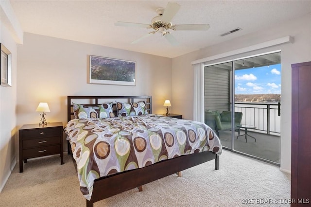 bedroom with carpet flooring, access to outside, ceiling fan, and visible vents