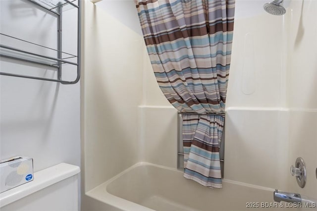 bathroom with shower / bath combination with curtain