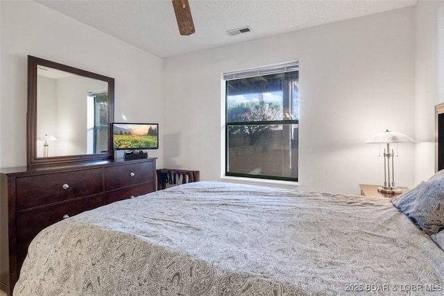 bedroom with a ceiling fan and visible vents