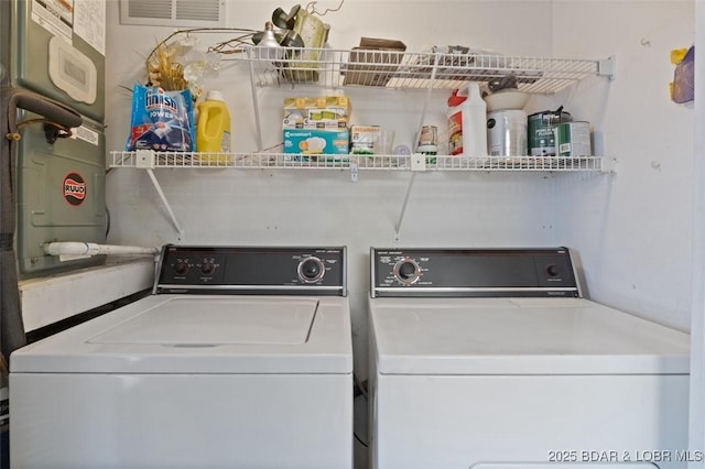 clothes washing area featuring laundry area and washer and dryer