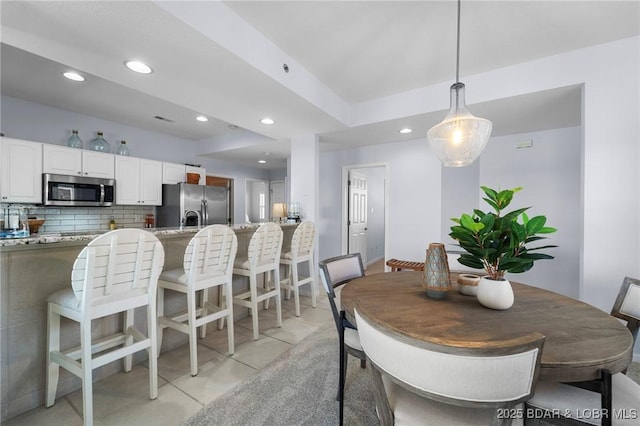 372 W Palisades Condo Dr Unit 4A, Lake Ozark, MO 65049 - dining space with recessed lighting and light tile patterned floors