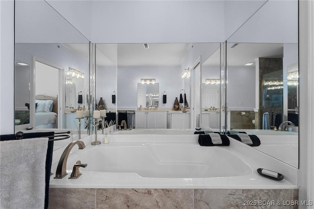 372 W Palisades Condo Dr Unit 4A, Lake Ozark, MO 65049 - ensuite bathroom with visible vents, a garden tub, ensuite bath, and vanity