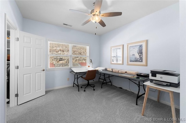 office area with a ceiling fan, carpet, visible vents, and baseboards