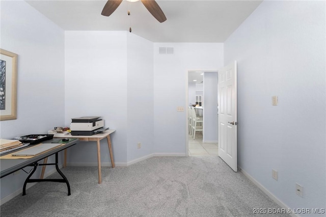 office area featuring carpet flooring, baseboards, visible vents, and ceiling fan