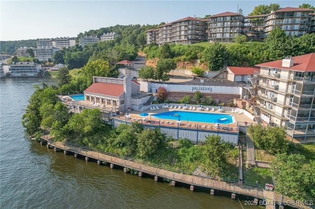 birds eye view of property with a water view