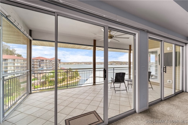 372 W Palisades Condo Dr Unit 4A, Lake Ozark, MO 65049 - doorway featuring a ceiling fan, a wealth of natural light, and a water view