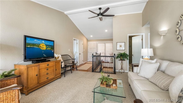 living area with baseboards, light carpet, beam ceiling, high vaulted ceiling, and a ceiling fan