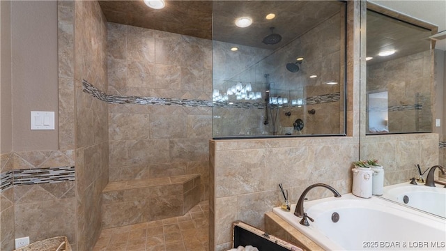 bathroom with a garden tub, tile walls, and walk in shower