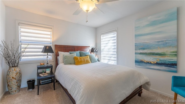 carpeted bedroom with baseboards and a ceiling fan