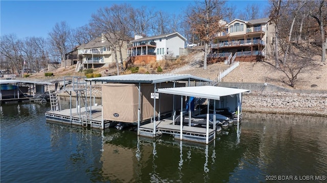 dock area featuring a water view and boat lift