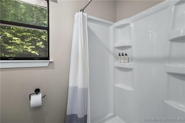 full bath with a shower with shower curtain