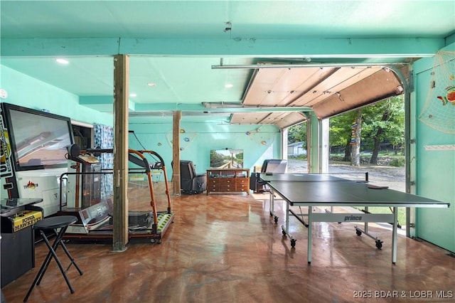 recreation room with finished concrete flooring