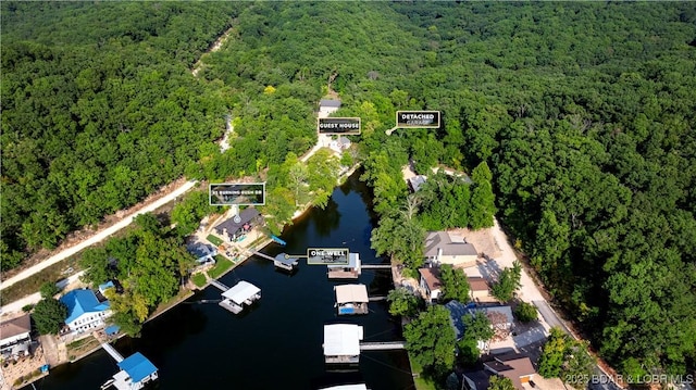 bird's eye view featuring a view of trees and a water view