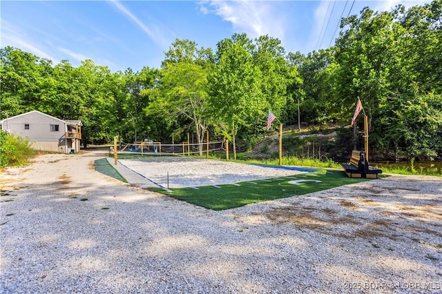 view of yard featuring volleyball court