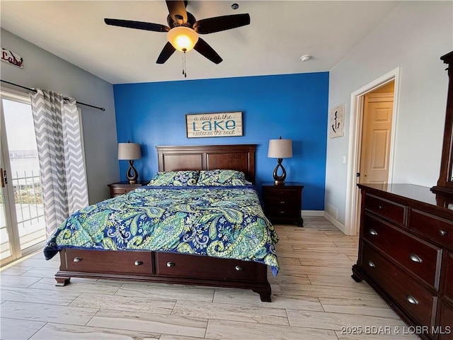 bedroom featuring access to exterior, light wood-style flooring, baseboards, and ceiling fan