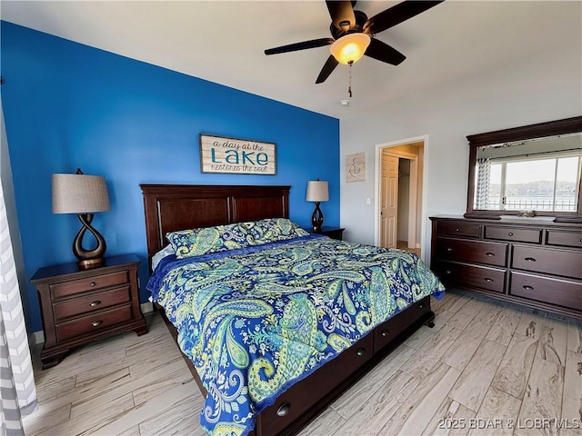 bedroom with light wood-style flooring and ceiling fan