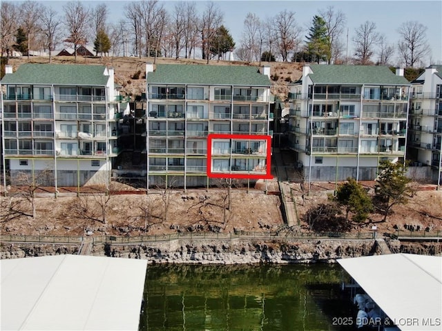 view of building exterior with a water view